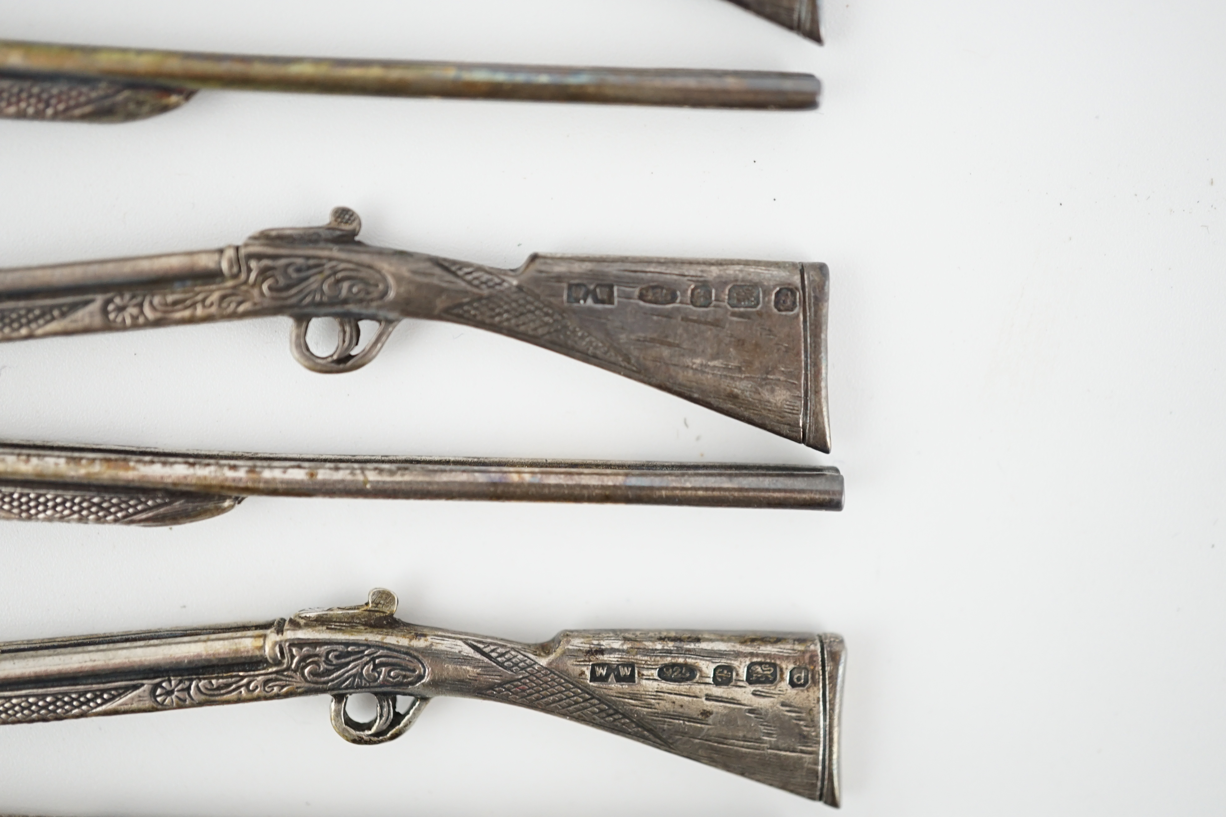 A modern set of eight novelty silver butt markers, modelled as double barrelled shotguns